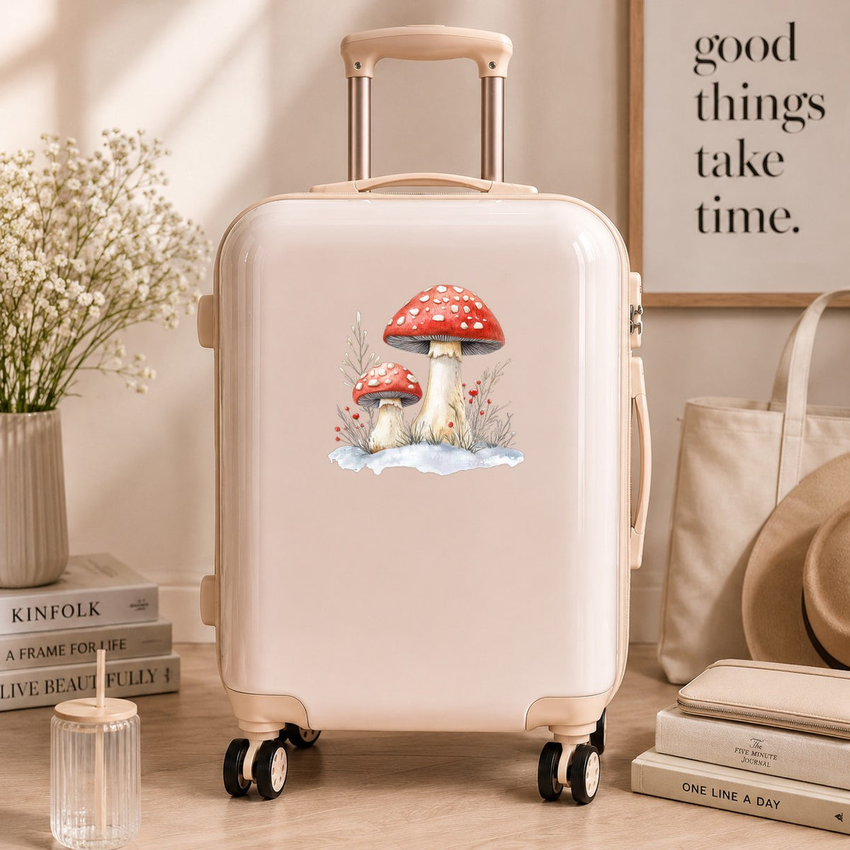 Red Mushrooms In Snow UV DTF sticker applied to a neutral suitcase