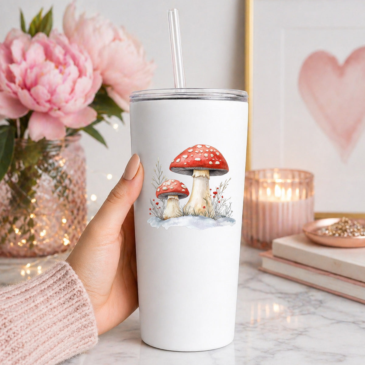 Red Mushrooms In Snow UV DTF sticker applied to a white tumbler