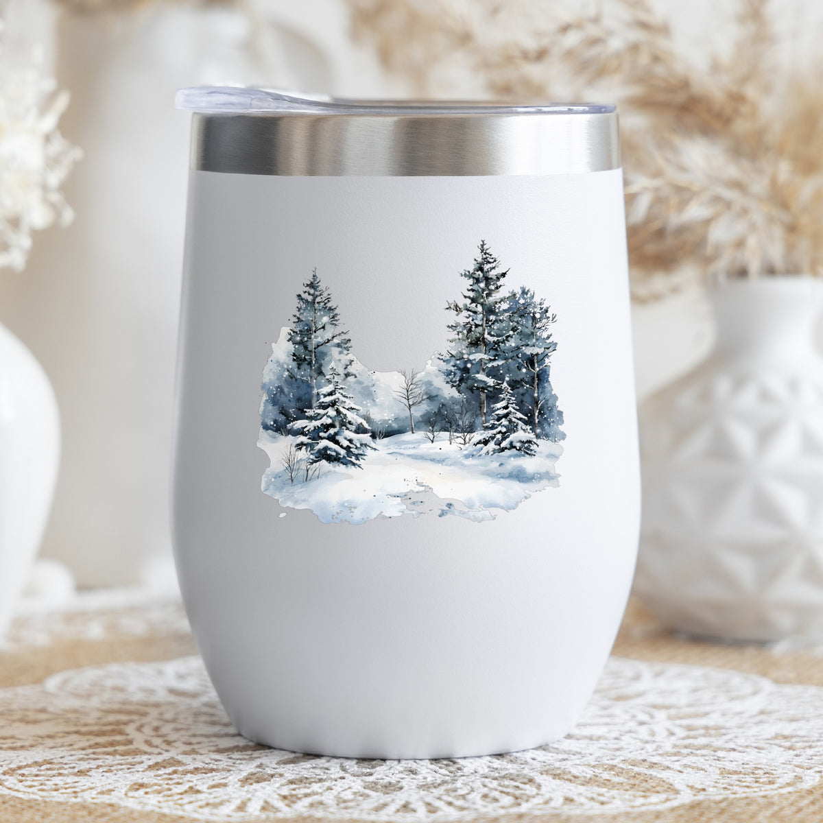 Falling Snow Pine Forest UV DTF sticker applied to a stemless wine glass