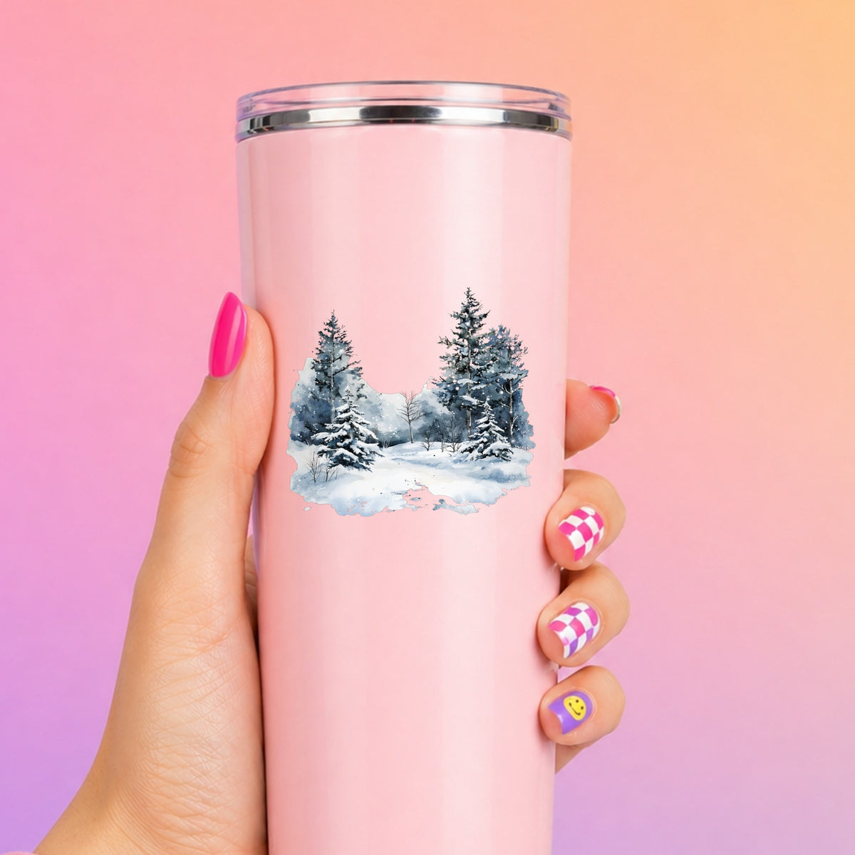 Falling Snow Pine Forest UV DTF sticker applied to a pink tumbler