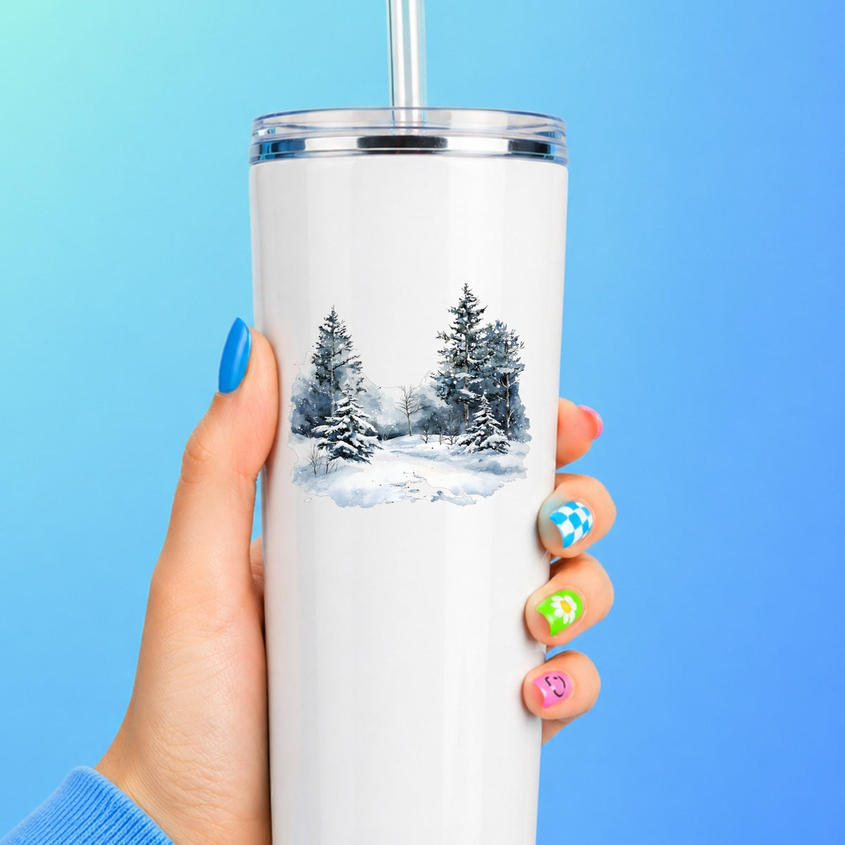 Falling Snow Pine Forest UV DTF sticker applied to a white tumbler