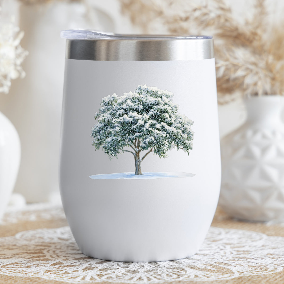 Snow Covered Tree UV DTF sticker applied to a stemless wine glass