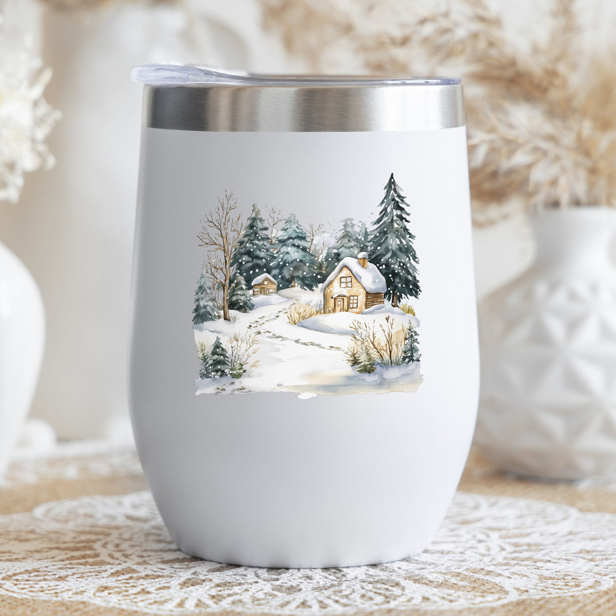 Snowy Cottage Village UV DTF sticker applied to a stemless wine glass