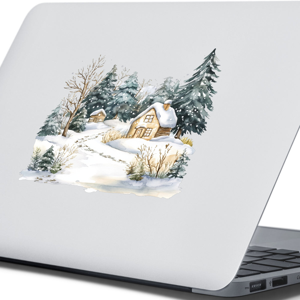 Snowy Cottage Village UV DTF sticker applied to a laptop