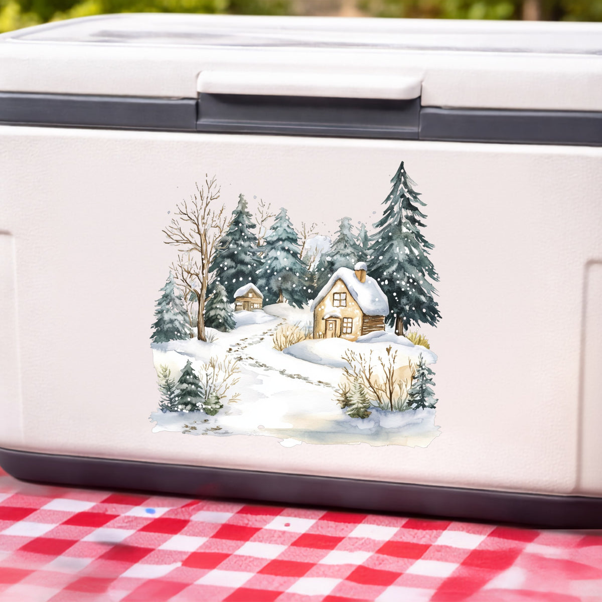 Snowy Cottage Village UV DTF sticker applied to a white cooler