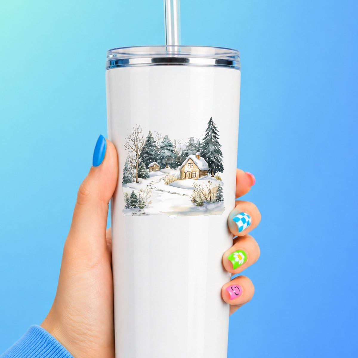 Snowy Cottage Village UV DTF sticker applied to a white tumbler