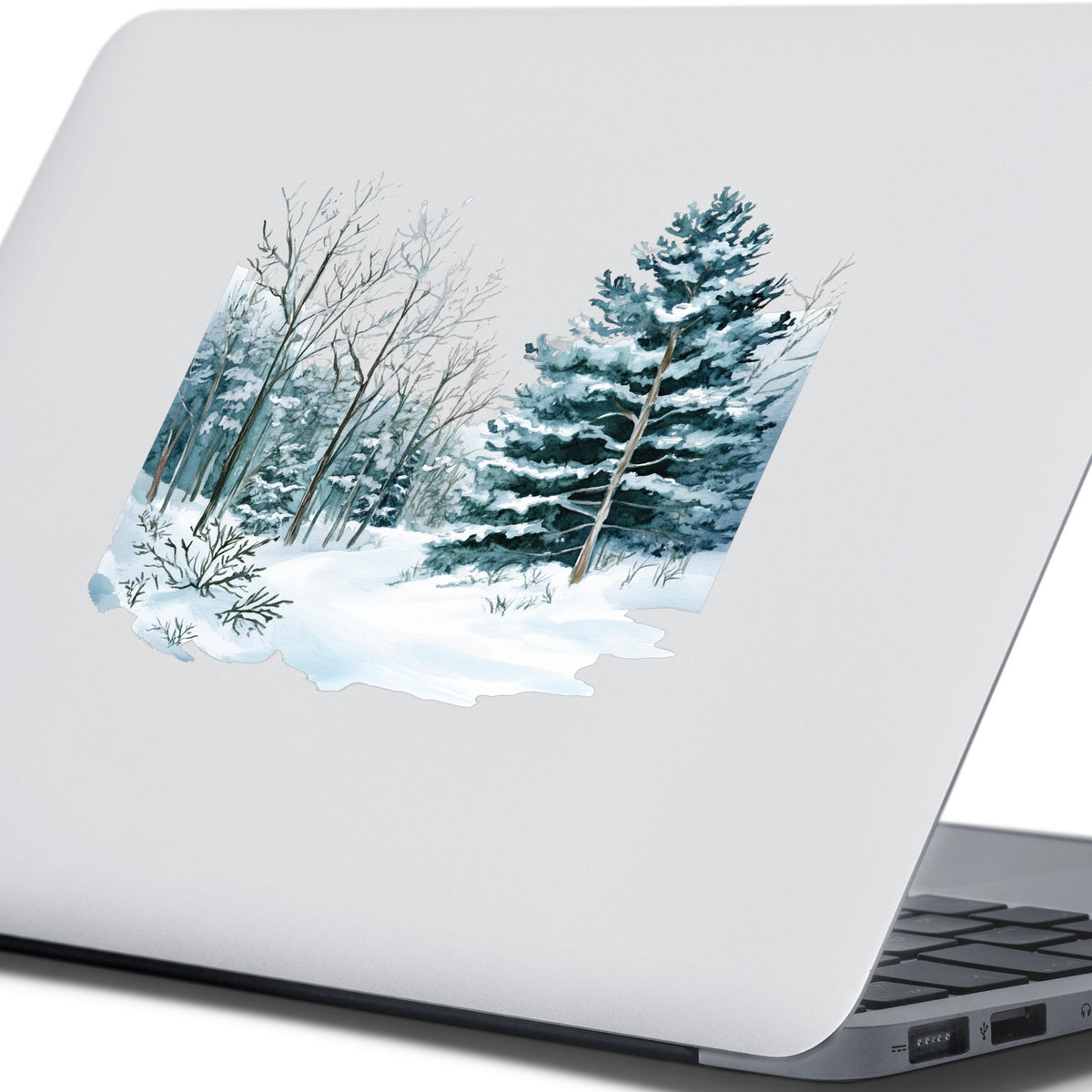 Tall Spruce Winter Forest UV DTF sticker applied to a laptop