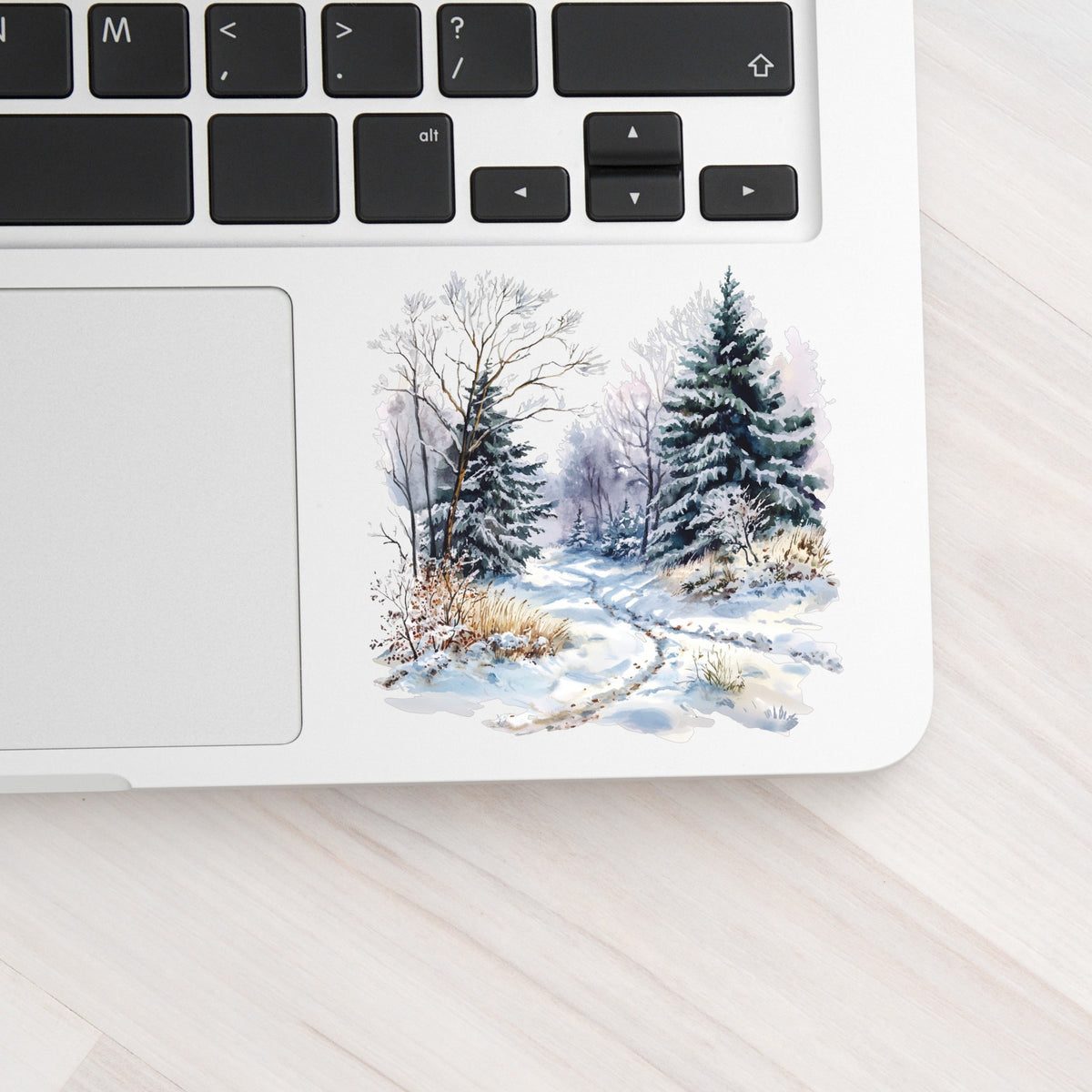 Lavender Winter Trail UV DTF sticker applied to a laptop beside the keyboard