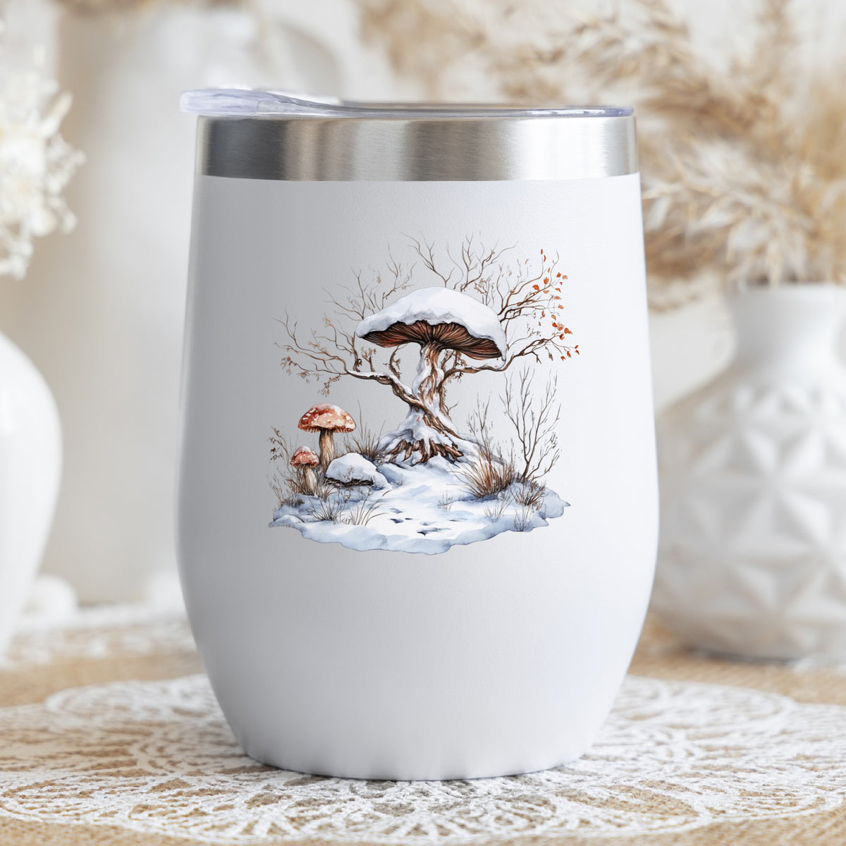 Whimsical Snowy Tree With Mushroom UV DTF sticker applied to a stemless wine glass