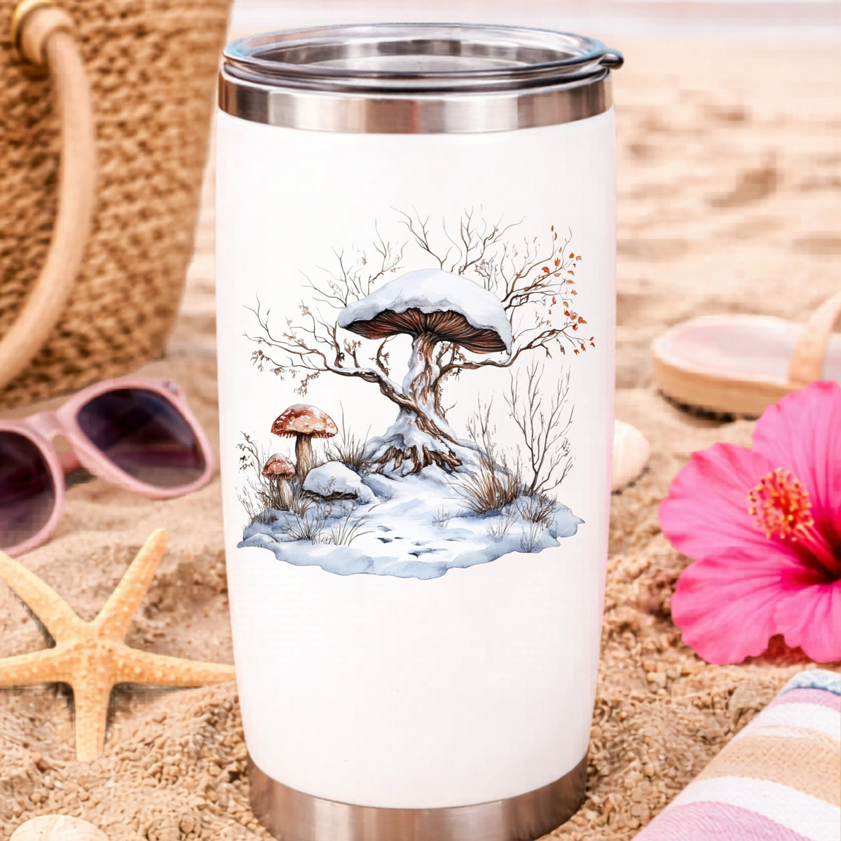 Whimsical Snowy Tree With Mushroom UV DTF sticker applied to a water bottle at the beach