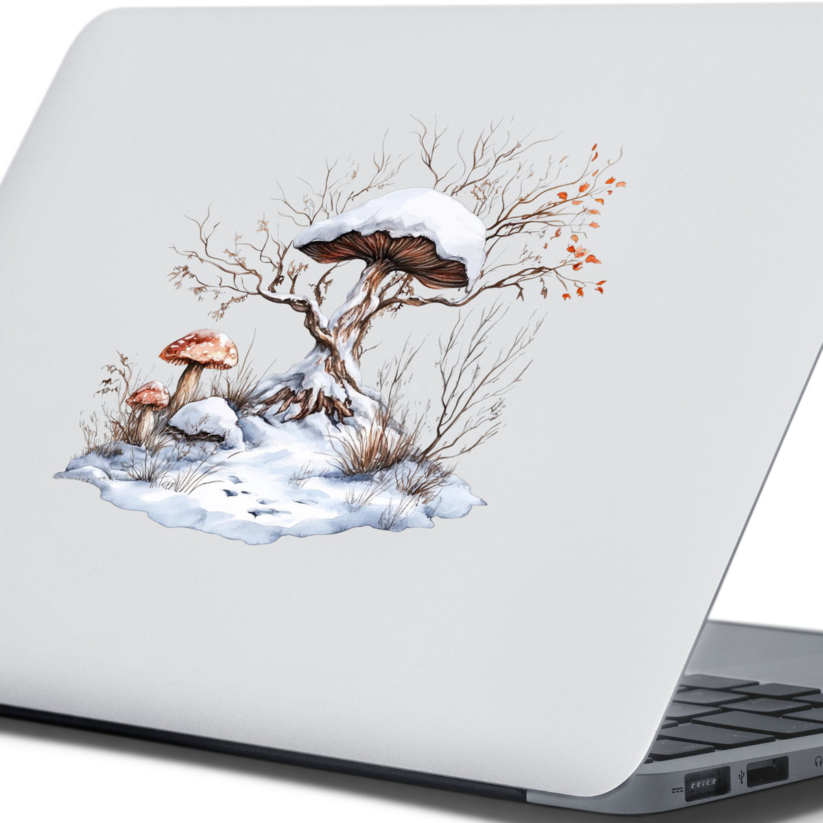 Whimsical Snowy Tree With Mushroom UV DTF sticker applied to a laptop