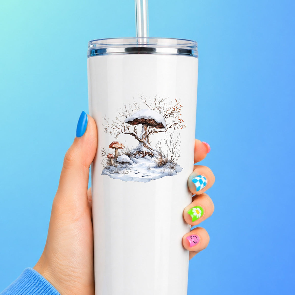 Whimsical Snowy Tree With Mushroom UV DTF sticker applied to a white tumbler