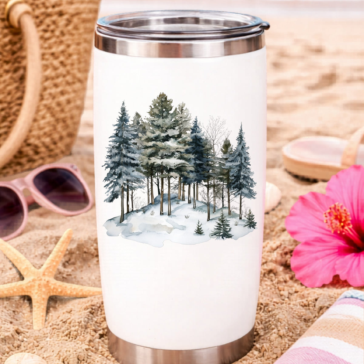 Snowy Pine Hillside UV DTF sticker applied to a water bottle at the beach