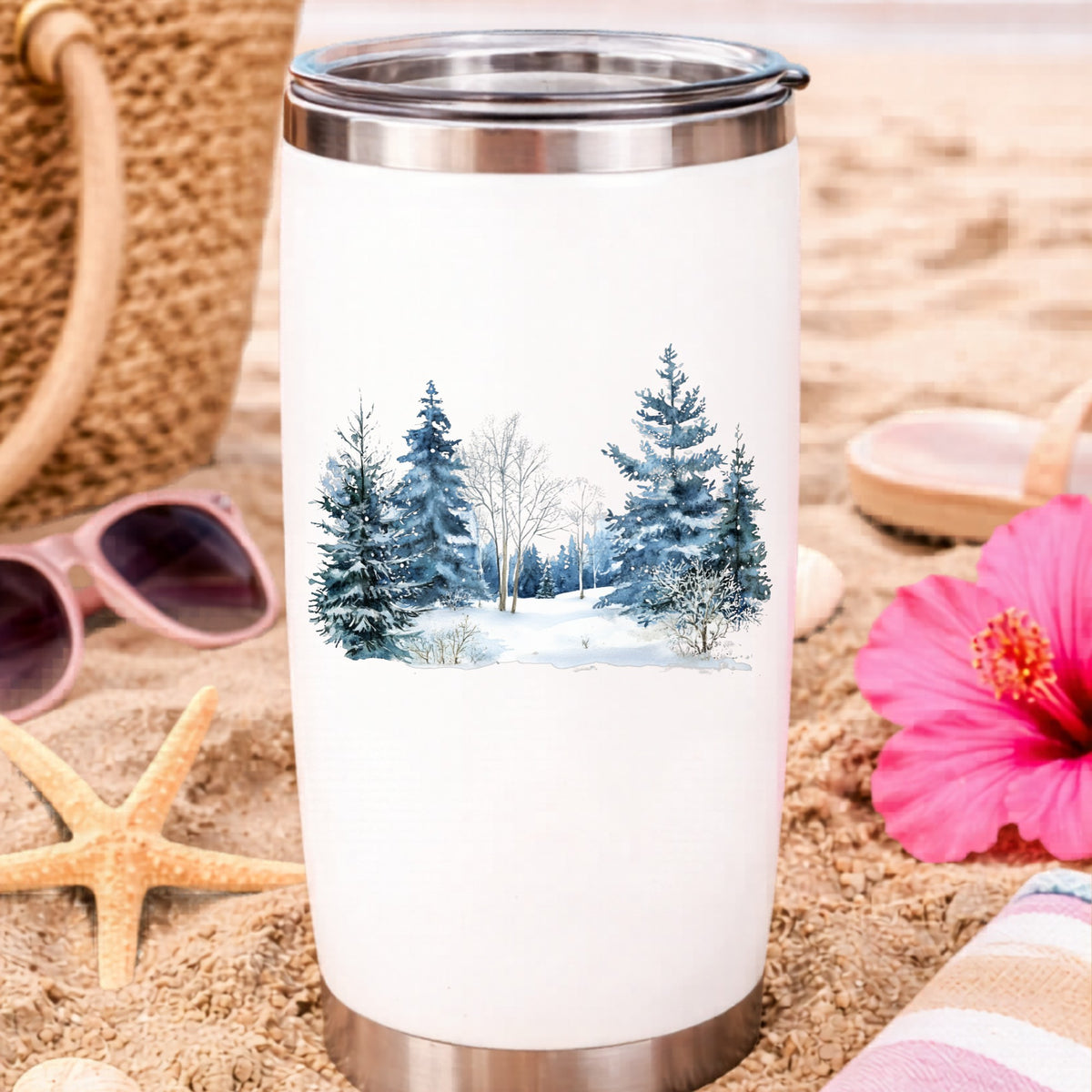 Blue Winter Pines And Birch UV DTF sticker applied to a water bottle at the beach