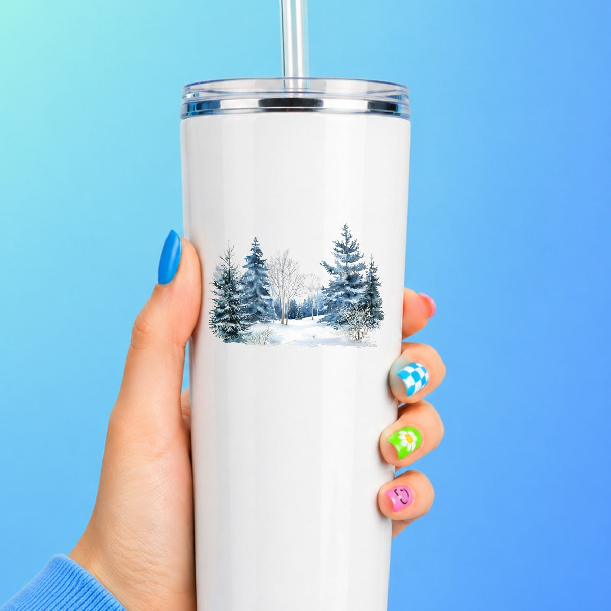 Blue Winter Pines And Birch UV DTF sticker applied to a white tumbler