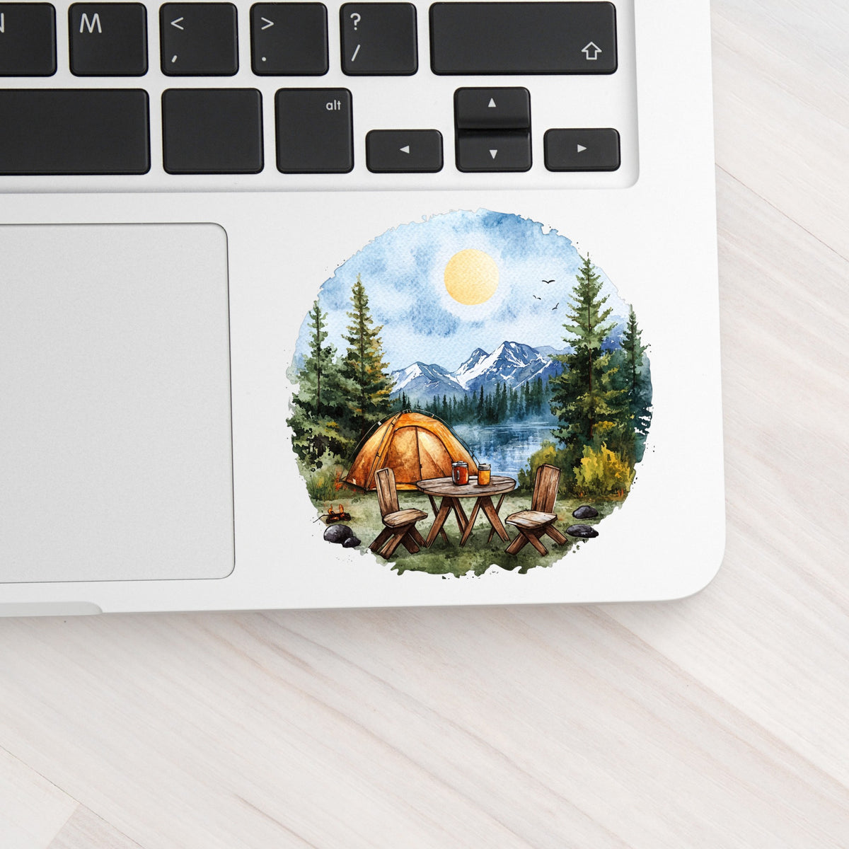 Lakeside Camp Scene UV DTF sticker applied to a laptop beside the keyboard