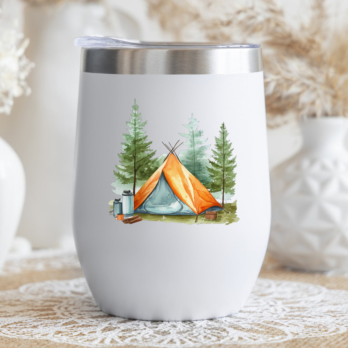 Orange Teepee Tent UV DTF sticker applied to a stemless wine glass