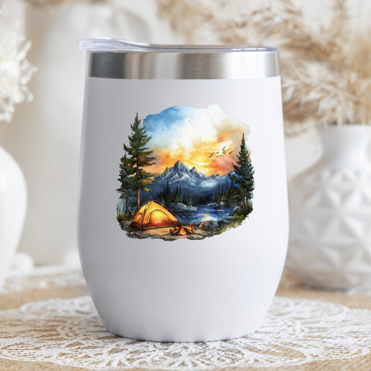 Sunset Mountain Campfire UV DTF sticker applied to a stemless wine glass
