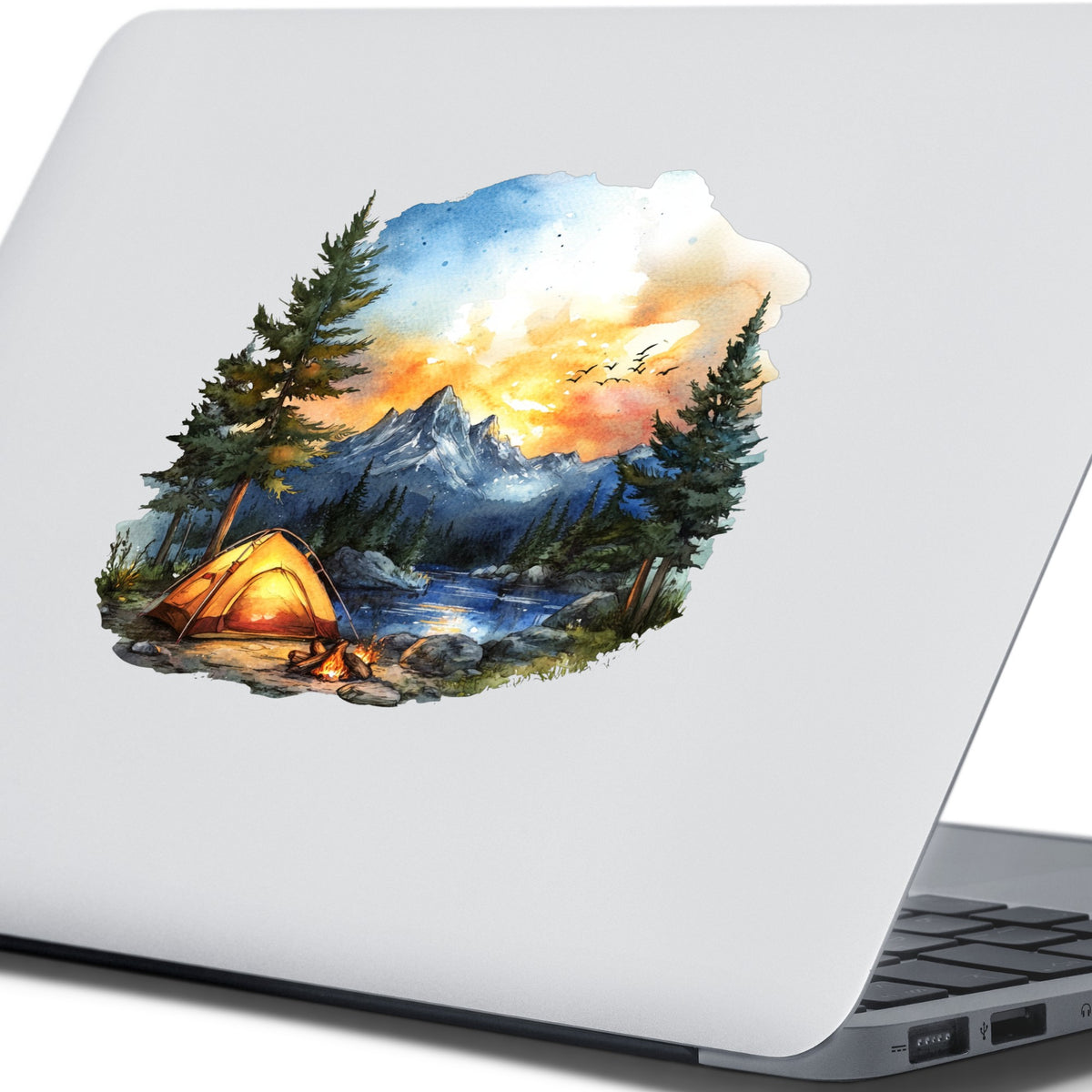 Sunset Mountain Campfire UV DTF sticker applied to a laptop