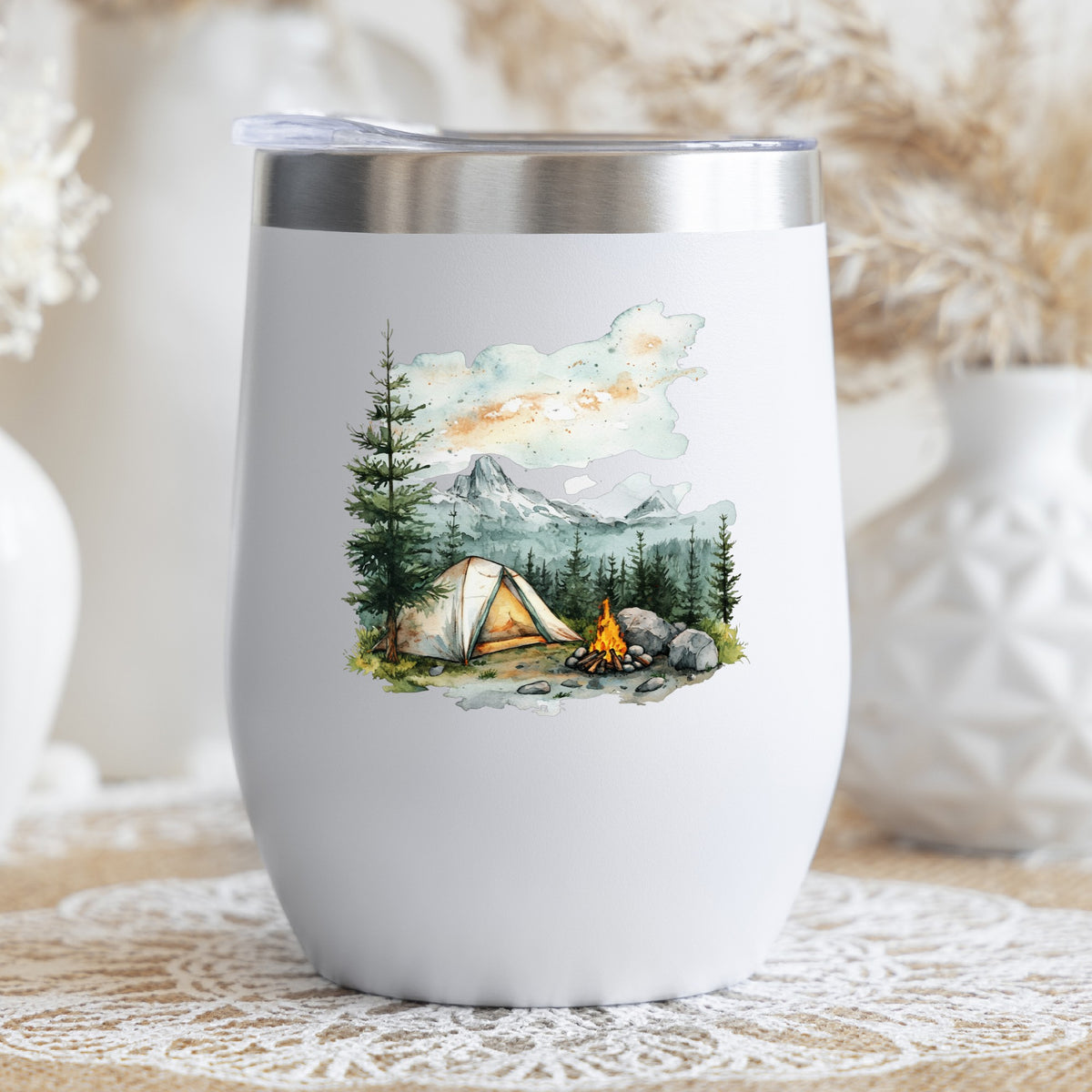 Misty Mountain Campsite UV DTF sticker applied to a stemless wine glass