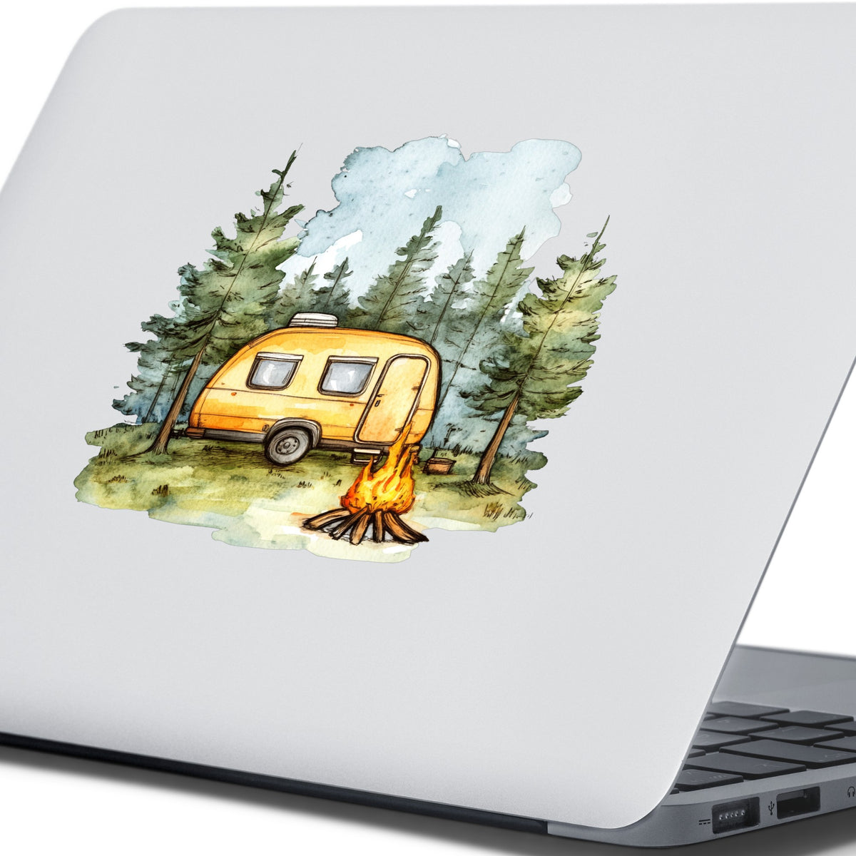 Yellow Camper Trailer UV DTF sticker applied to a laptop