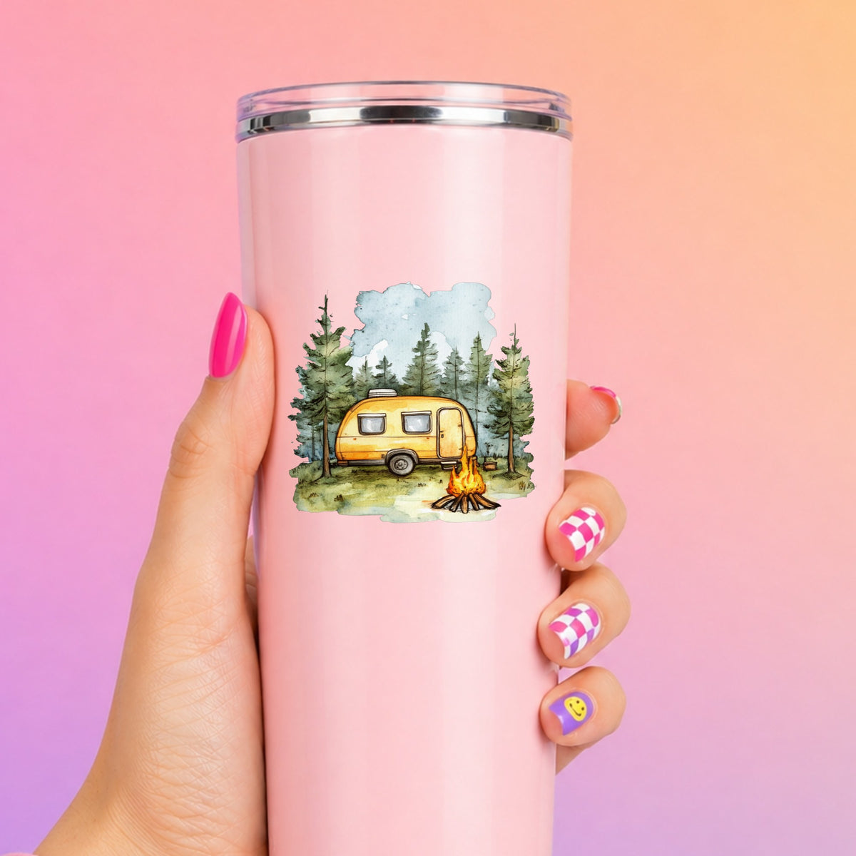 Yellow Camper Trailer UV DTF sticker applied to a pink tumbler