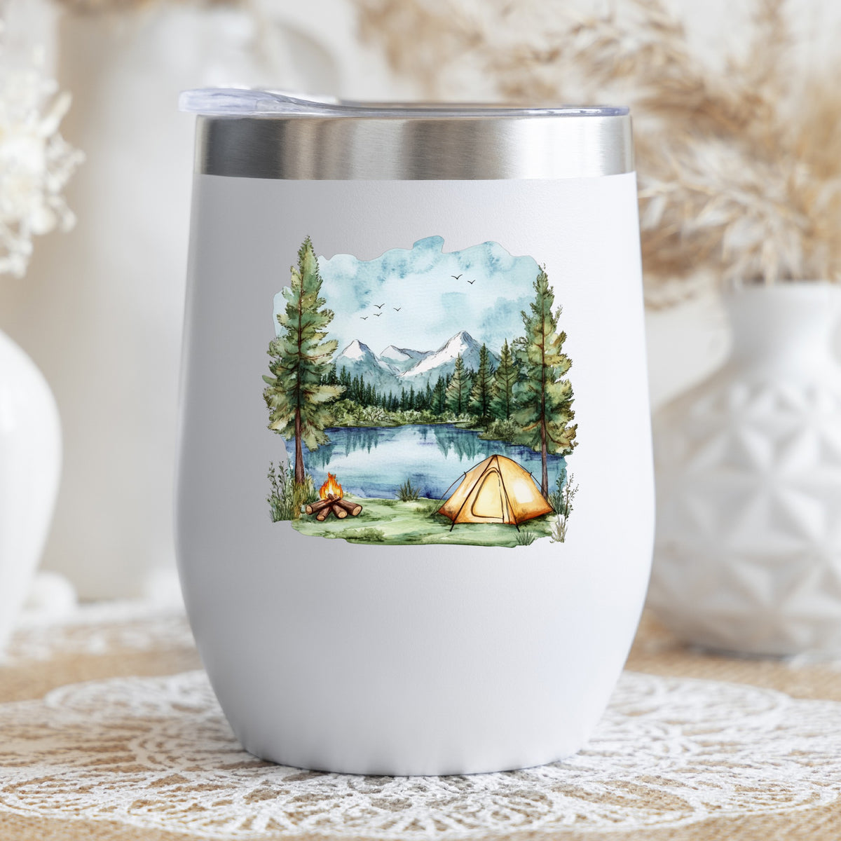 Lake Campfire And Tent UV DTF sticker applied to a stemless wine glass