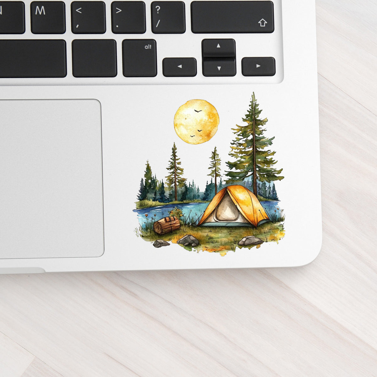 Sunny Lake Campsite UV DTF sticker applied to a laptop beside the keyboard