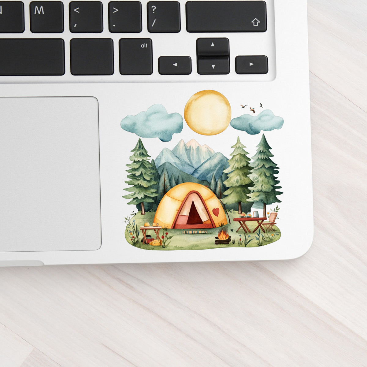 Mountain Camp Tent UV DTF sticker applied to a laptop beside the keyboard