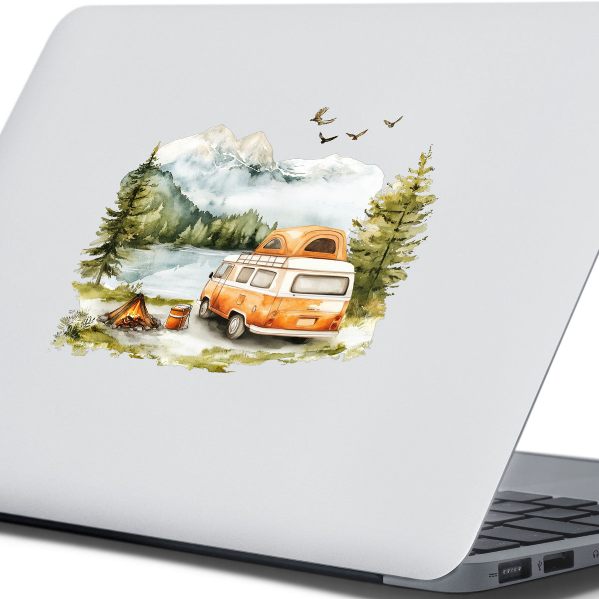 Orange Camper Van UV DTF sticker applied to a laptop