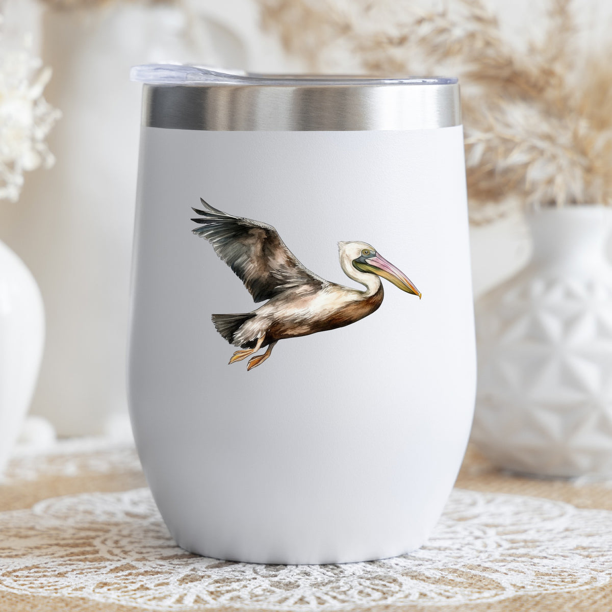 Flying Brown Pelican UV DTF sticker applied to a stemless wine glass
