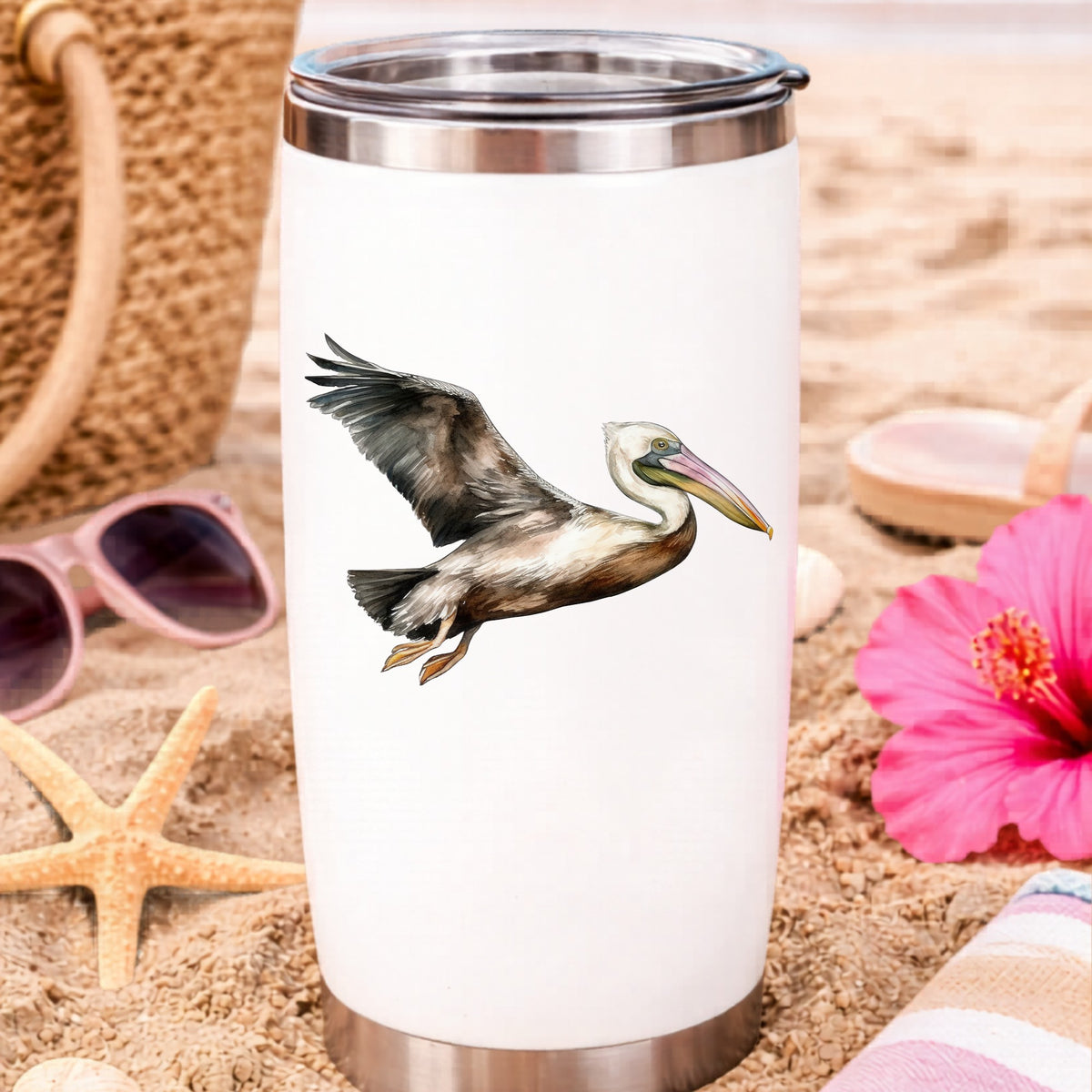 Flying Brown Pelican UV DTF sticker applied to a water bottle at the beach