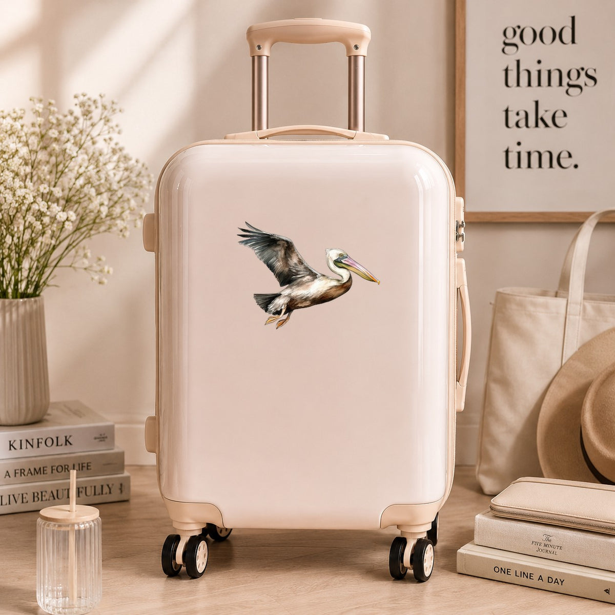 Flying Brown Pelican UV DTF sticker applied to a neutral suitcase