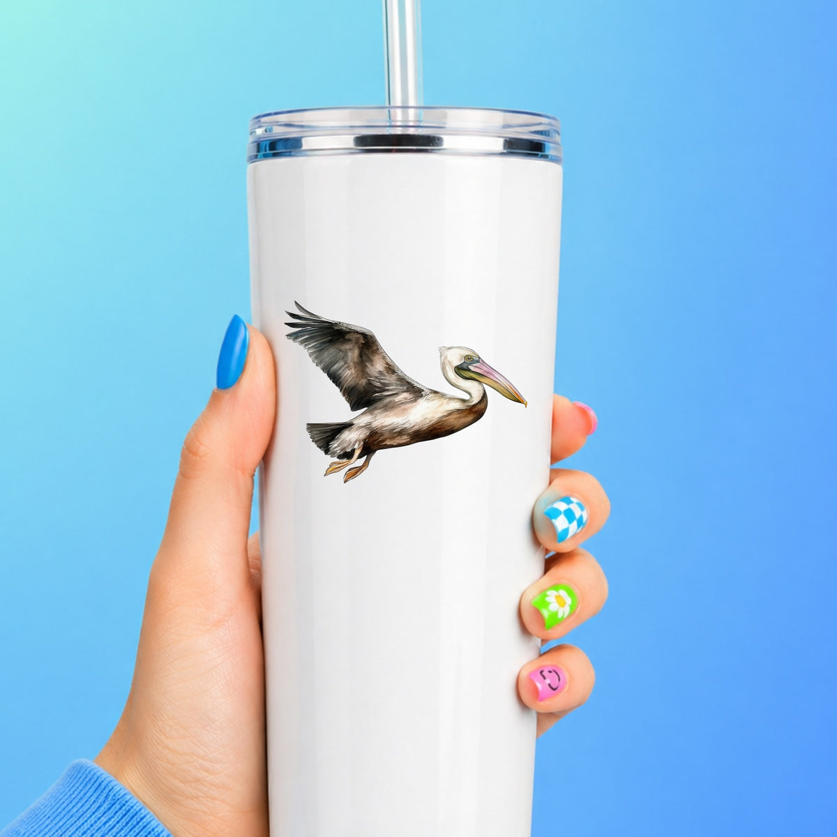 Flying Brown Pelican UV DTF sticker applied to a white tumbler