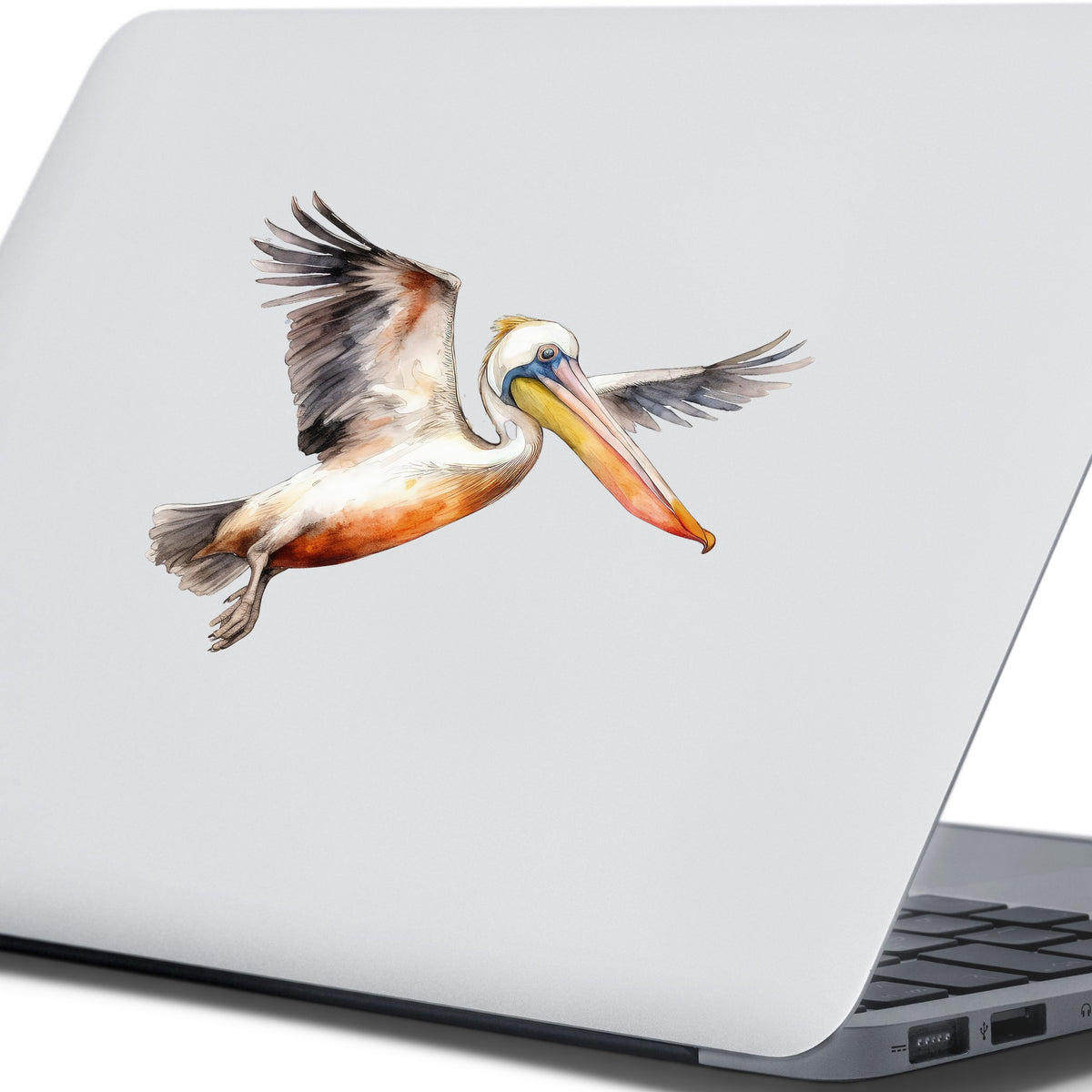 Pelican With Wings Spread UV DTF sticker applied to a laptop