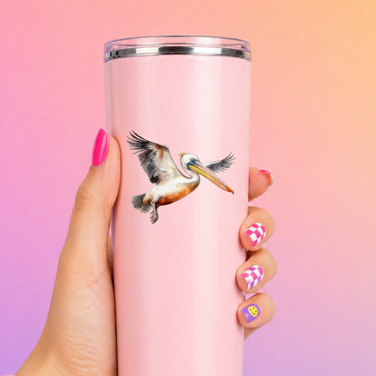 Pelican With Wings Spread UV DTF sticker applied to a pink tumbler