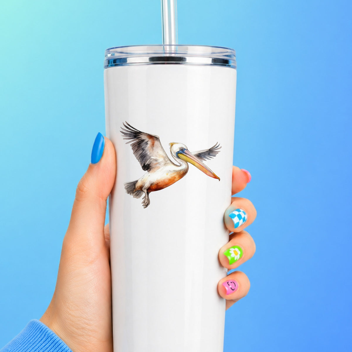 Pelican With Wings Spread UV DTF sticker applied to a white tumbler