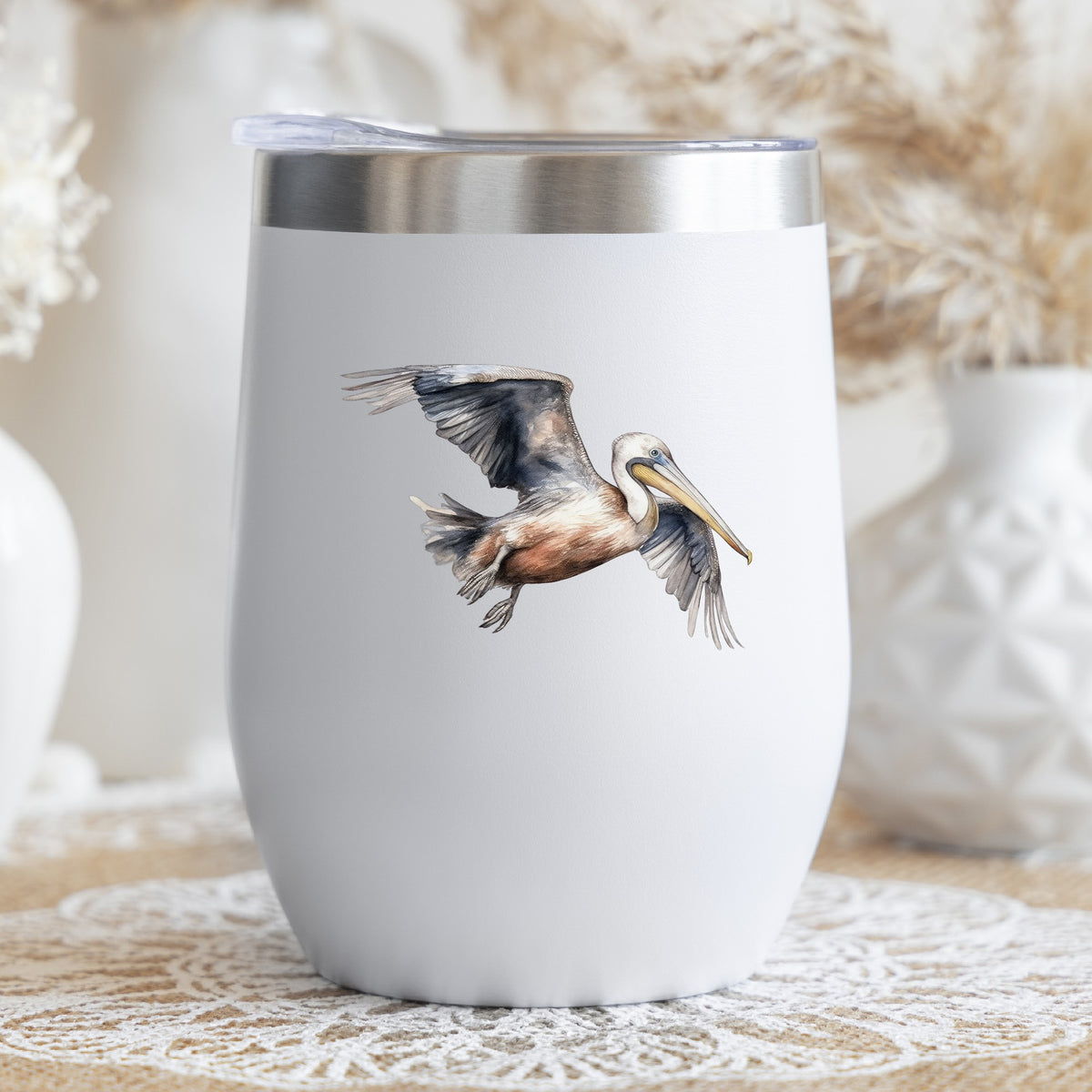 Gliding Gray Pelican UV DTF sticker applied to a stemless wine glass