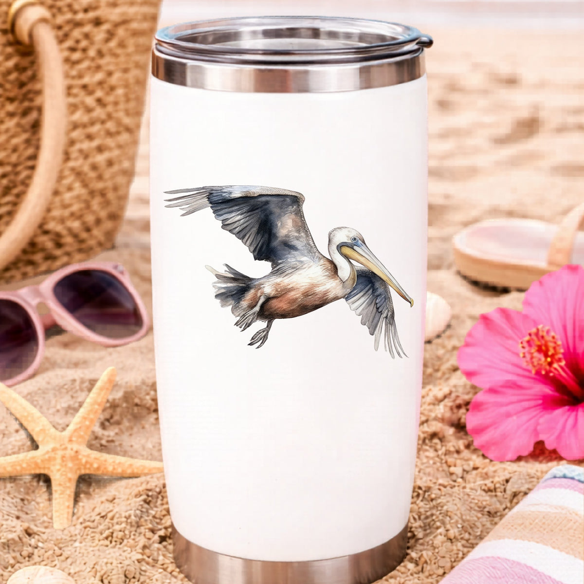 Gliding Gray Pelican UV DTF sticker applied to a water bottle at the beach