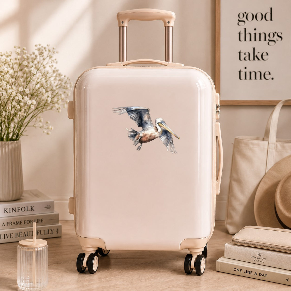 Gliding Gray Pelican UV DTF sticker applied to a neutral suitcase