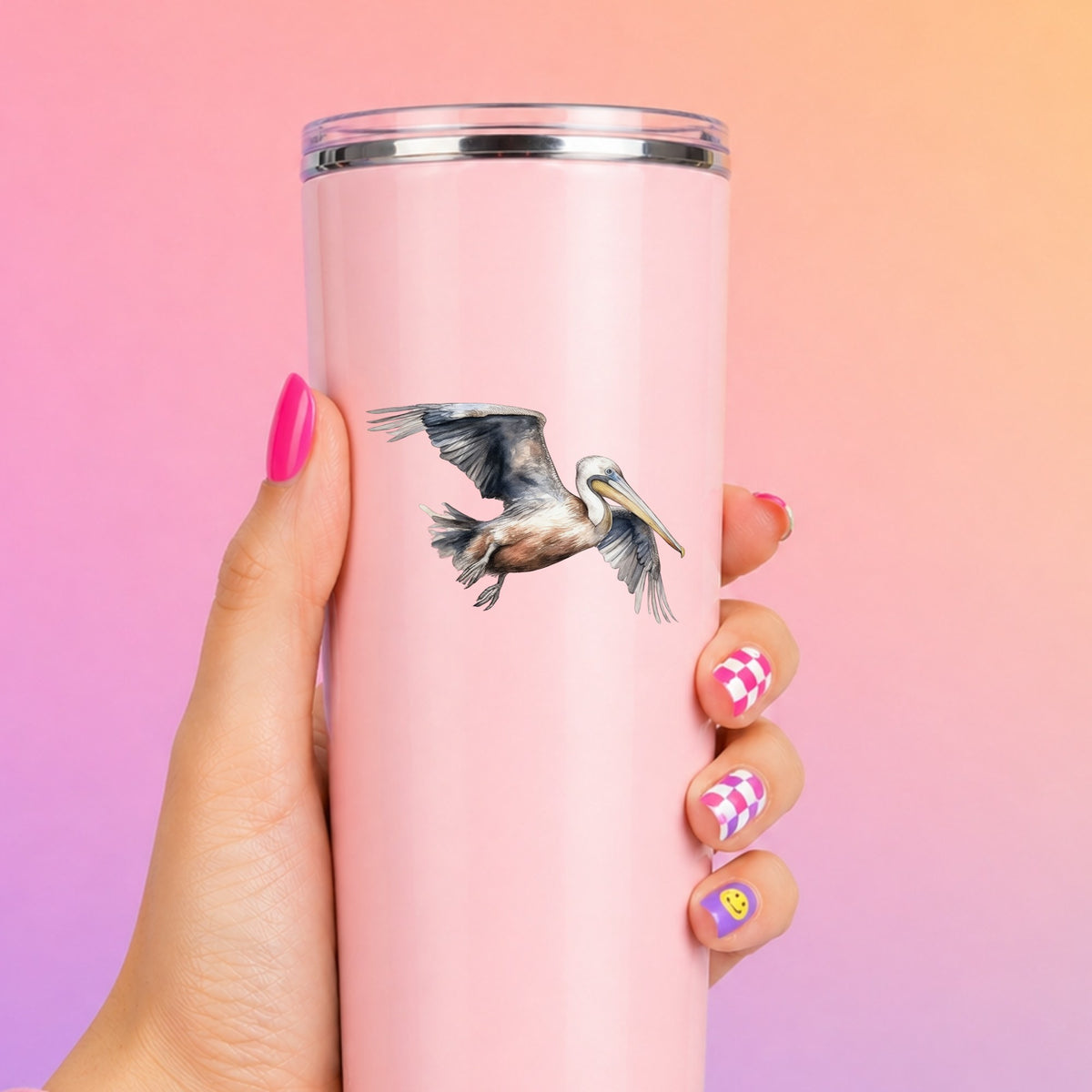 Gliding Gray Pelican UV DTF sticker applied to a pink tumbler