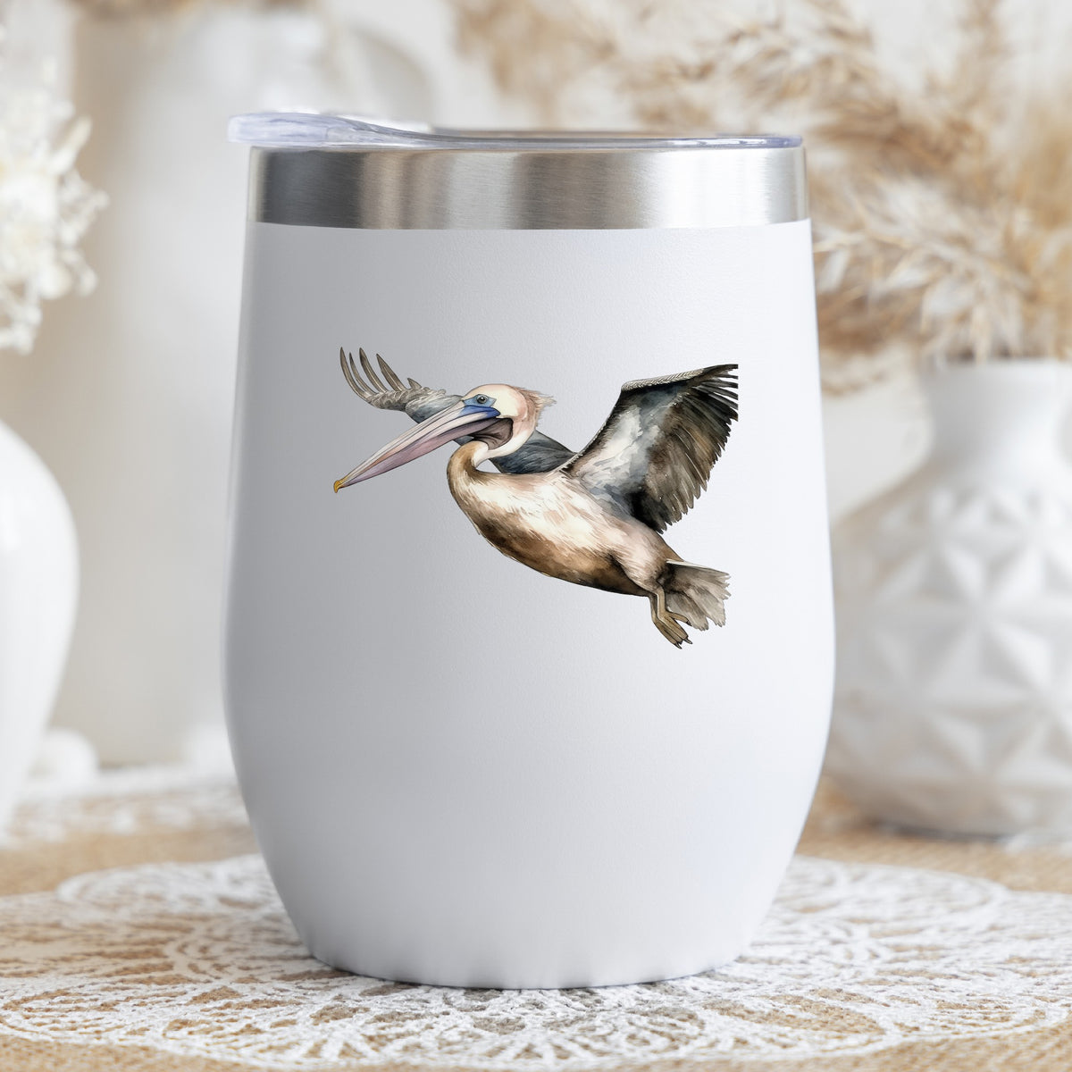 Pelican In Flight UV DTF sticker applied to a stemless wine glass
