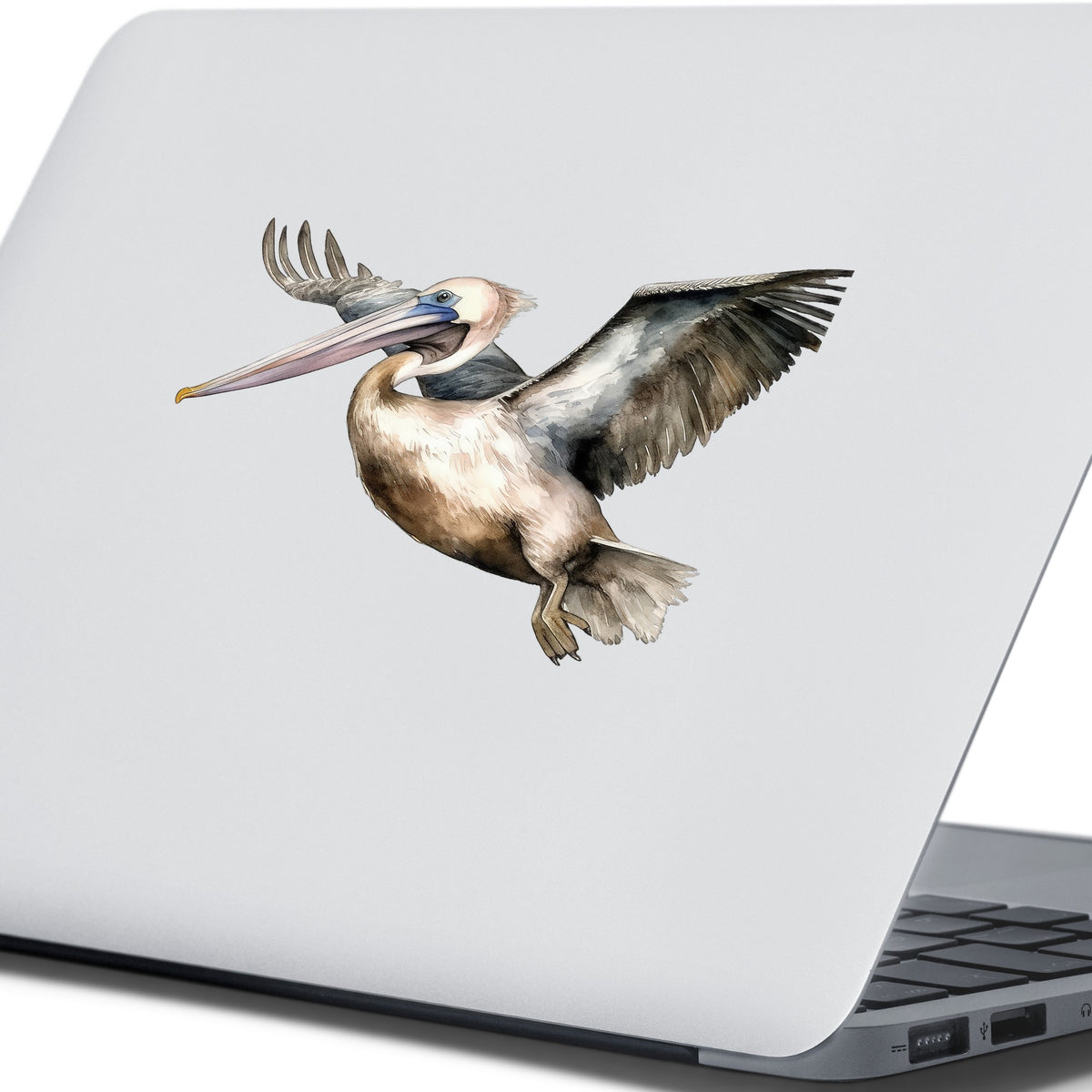 Pelican In Flight UV DTF sticker applied to a laptop