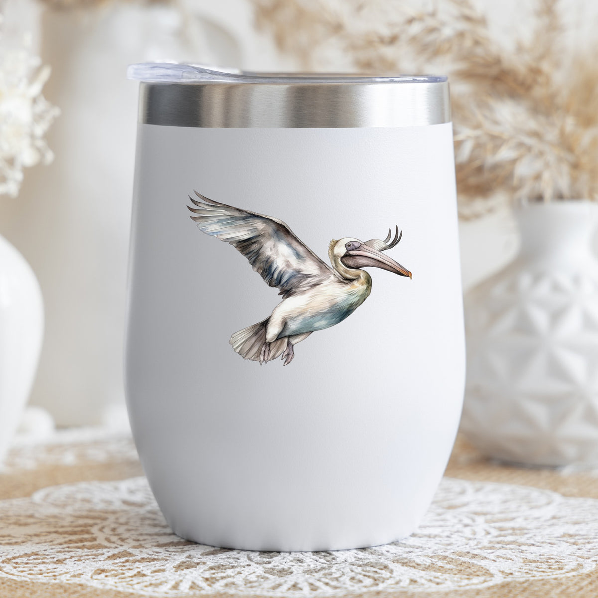 Pale Blue Pelican UV DTF sticker applied to a stemless wine glass