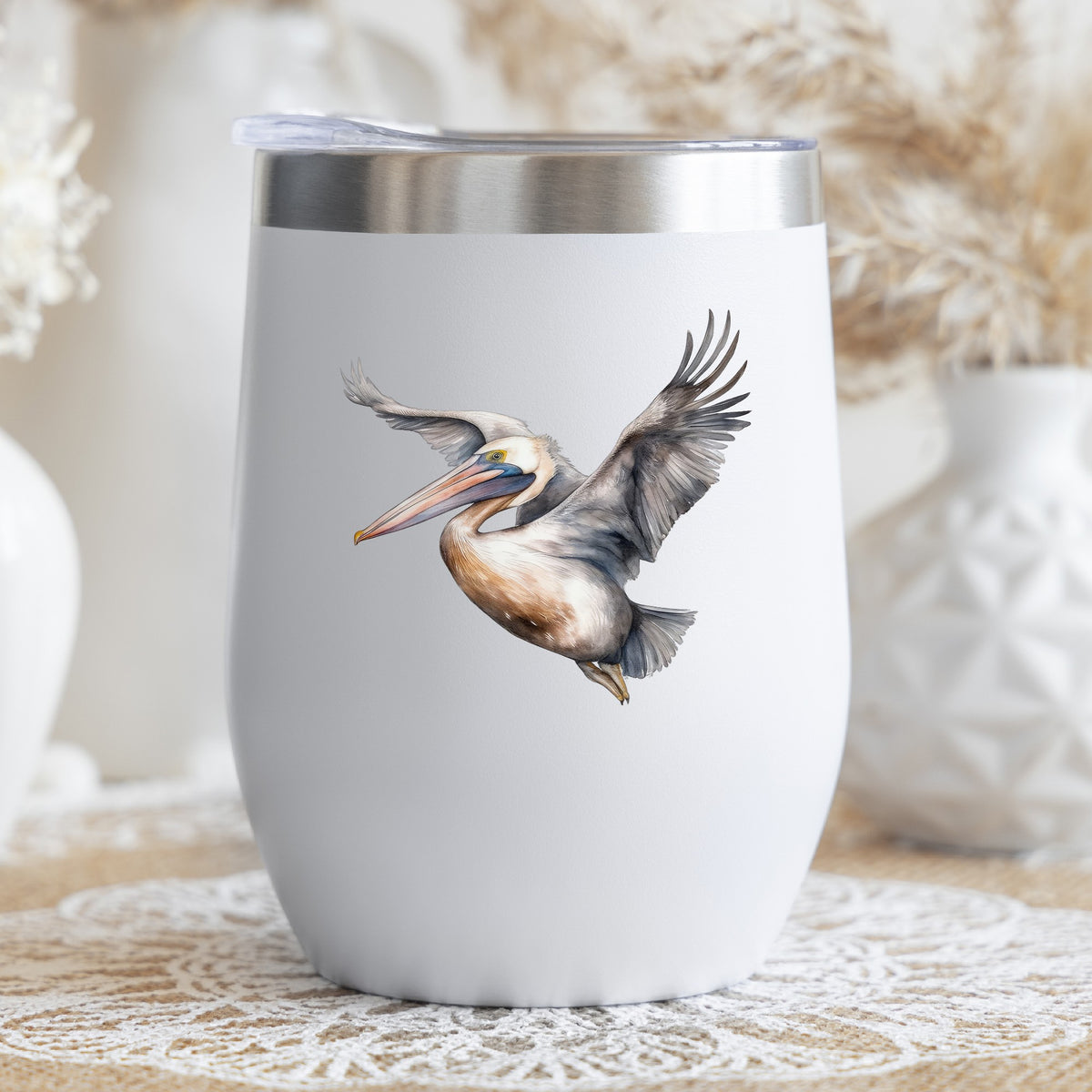 Soaring Pelican UV DTF sticker applied to a stemless wine glass
