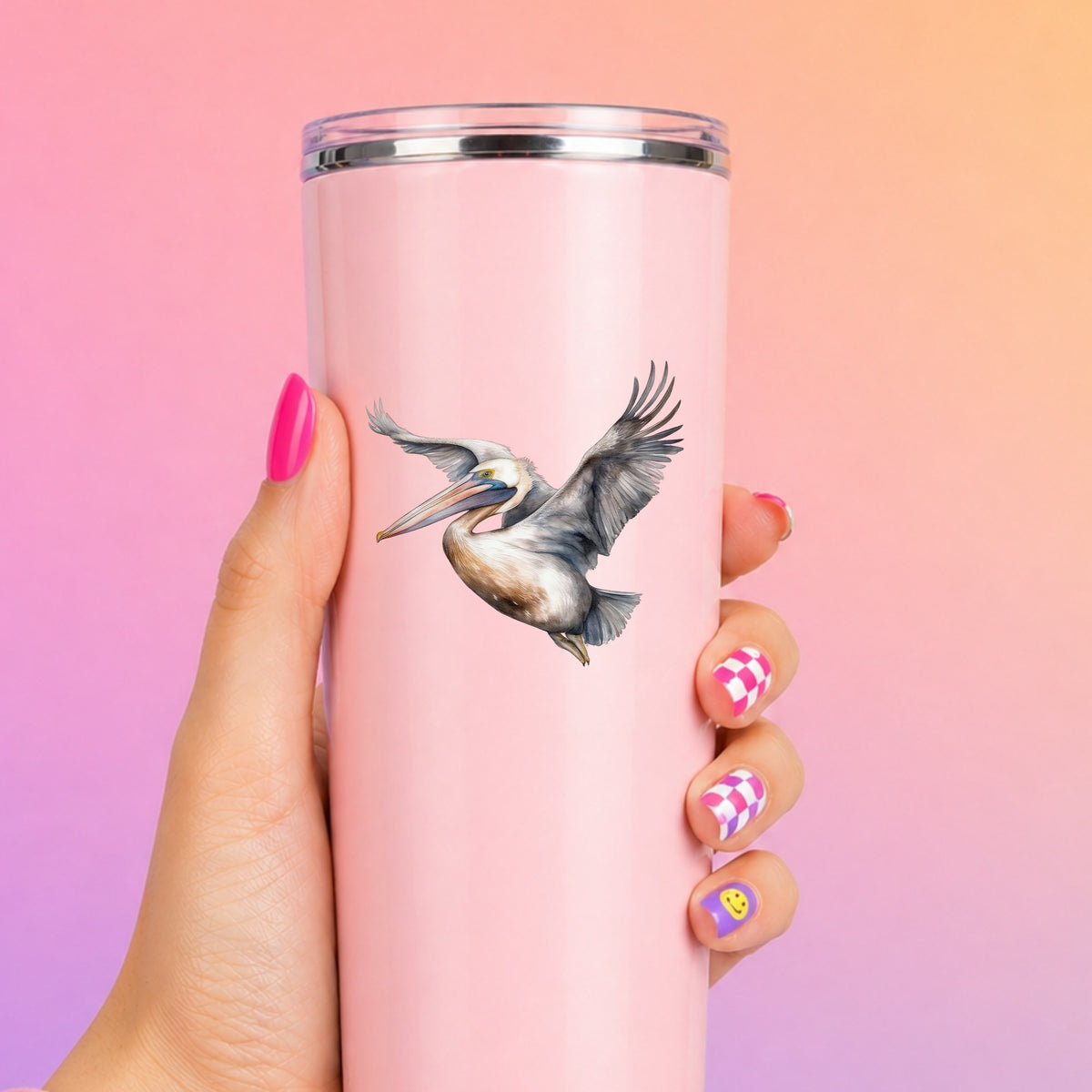 Soaring Pelican UV DTF sticker applied to a pink tumbler