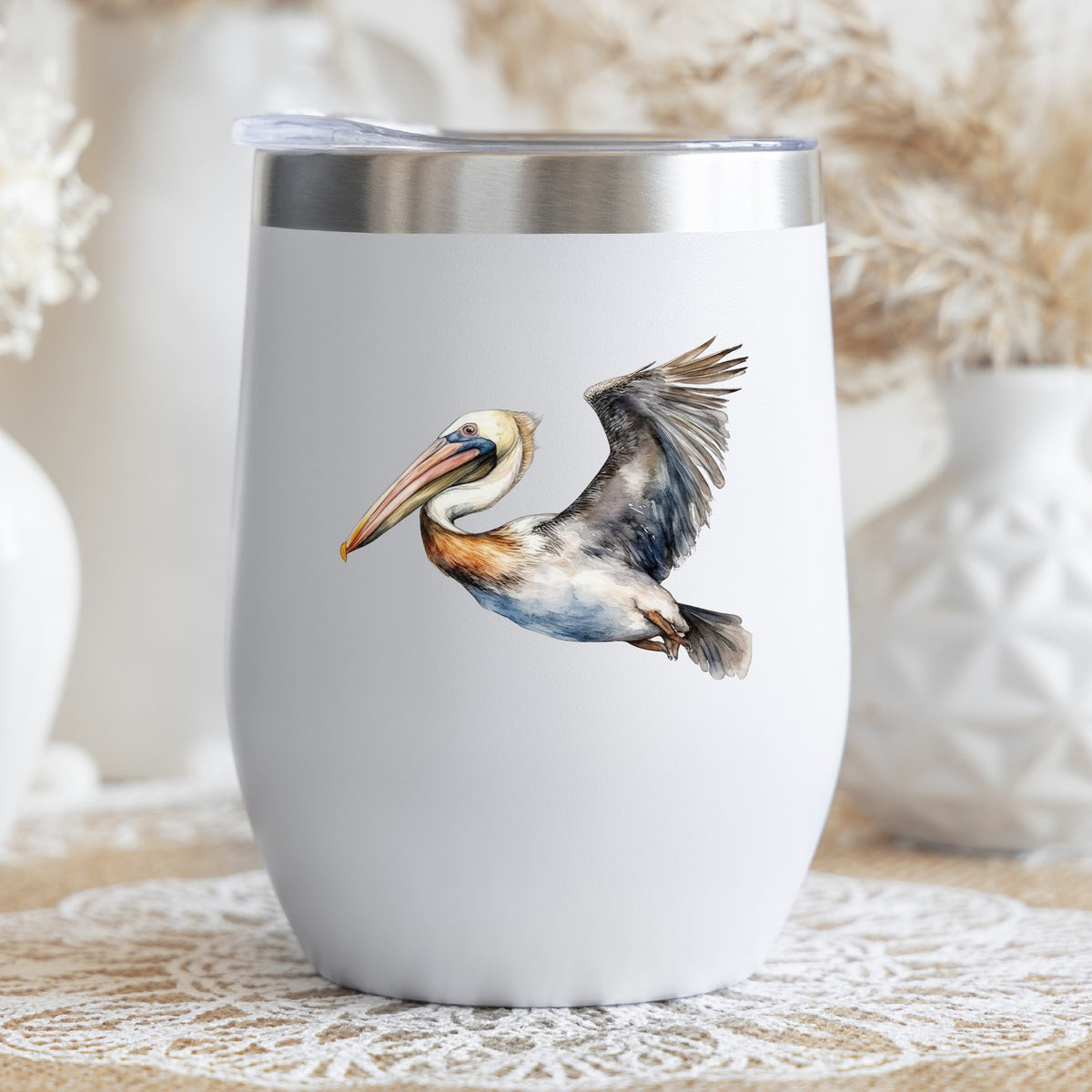 Wide Winged Pelican UV DTF sticker applied to a stemless wine glass