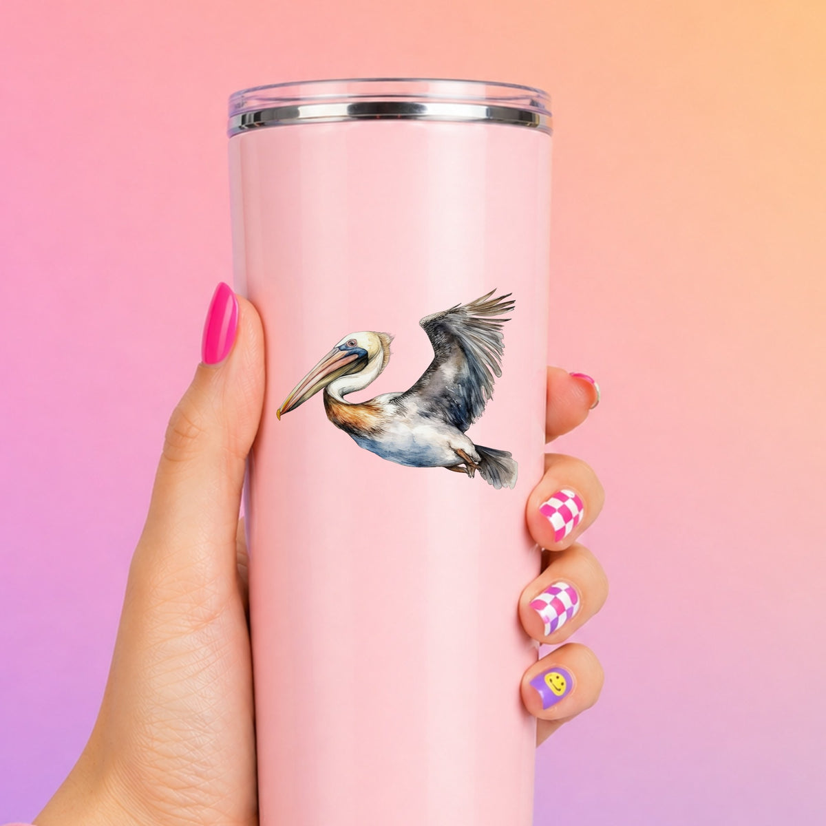 Wide Winged Pelican UV DTF sticker applied to a pink tumbler
