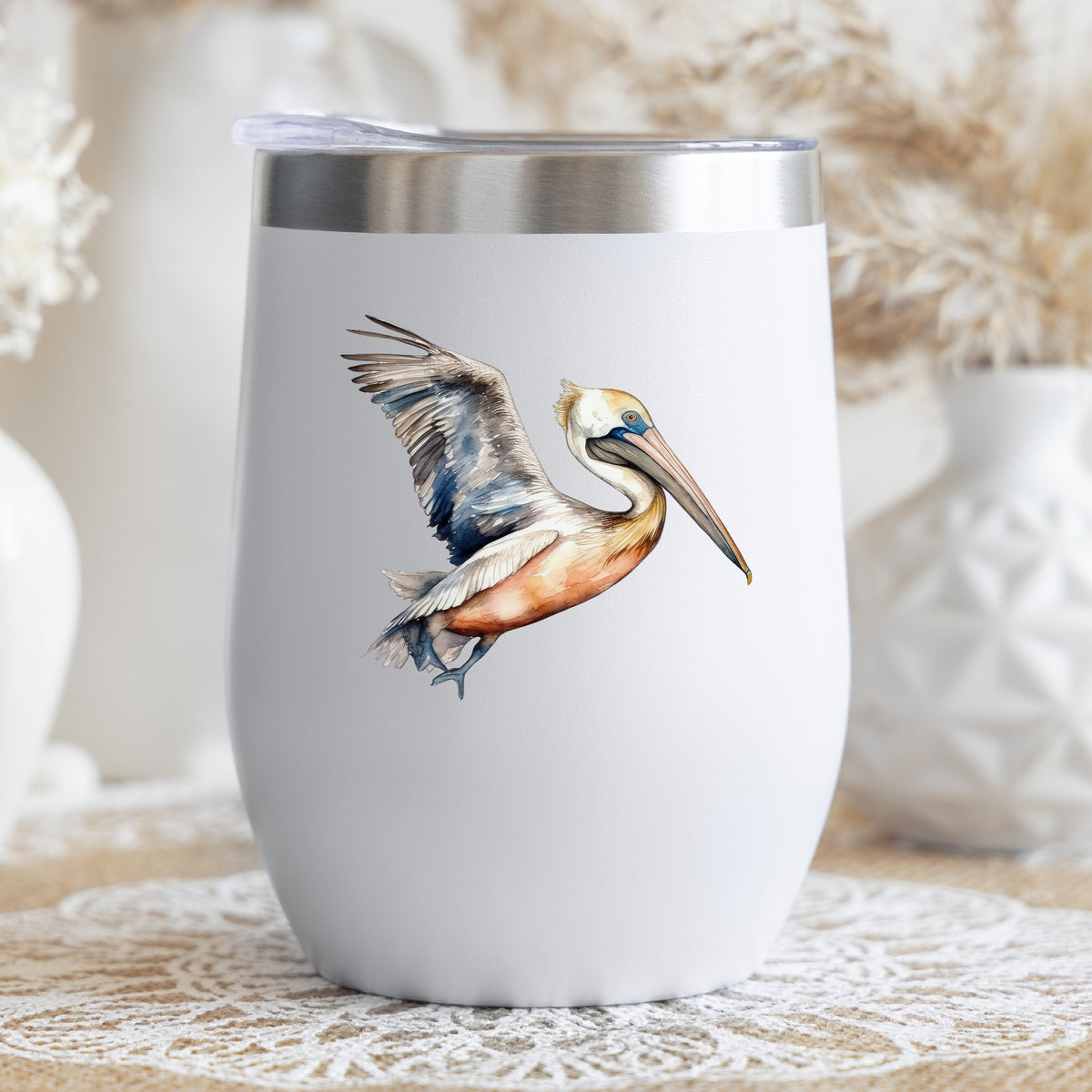 Blue Winged Pelican UV DTF sticker applied to a stemless wine glass