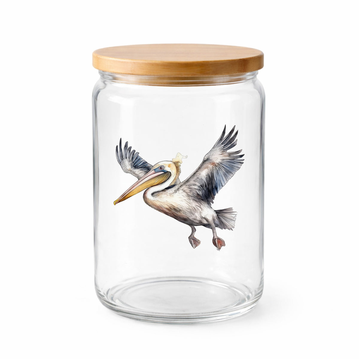 Pelican Taking Flight UV DTF sticker applied to a clear glass jar with lid